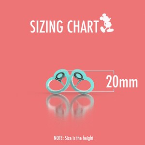 May include: A sizing chart with two light blue heart-shaped objects, each with a black center, and a measurement of 20mm. The text "SIZING CHART" is at the top, with a Mickey Mouse silhouette. The note at the bottom says "Size is the height."