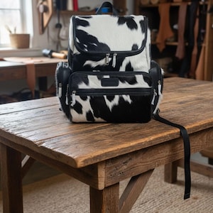 cowhide backpack

hair on hide bag

leather rucksack

cowhide purse

travel backpack

Christmas gift mom

leather gym bag

mom gift idea

cowhide leather bag

weekend travel bag

handmade leather bag

carry on backpack

boho cowhide bag