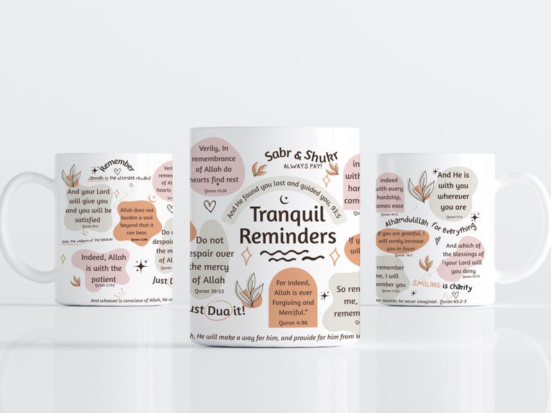 May include: Three white ceramic mugs with inspirational quotes and floral designs. The mugs feature phrases like "Tranquil Reminders" and "Smiling is charity" in a mix of fonts and colors.