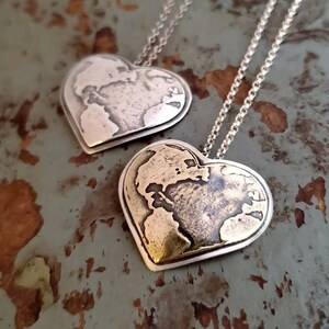 World Heart necklace in silver or brass and silver