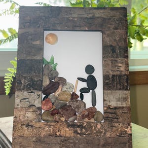 Hiking pebble art made with sea glass, sea shell, and pebbles. “The Adventure Begins”