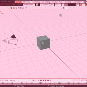 May include: A 3D modeling software interface with a gray cube in the center of a pink grid. The cube is surrounded by a white star-shaped icon. The interface includes a toolbar with options for modeling, sculpting, UV editing, texture painting, shading, animation, and scene.