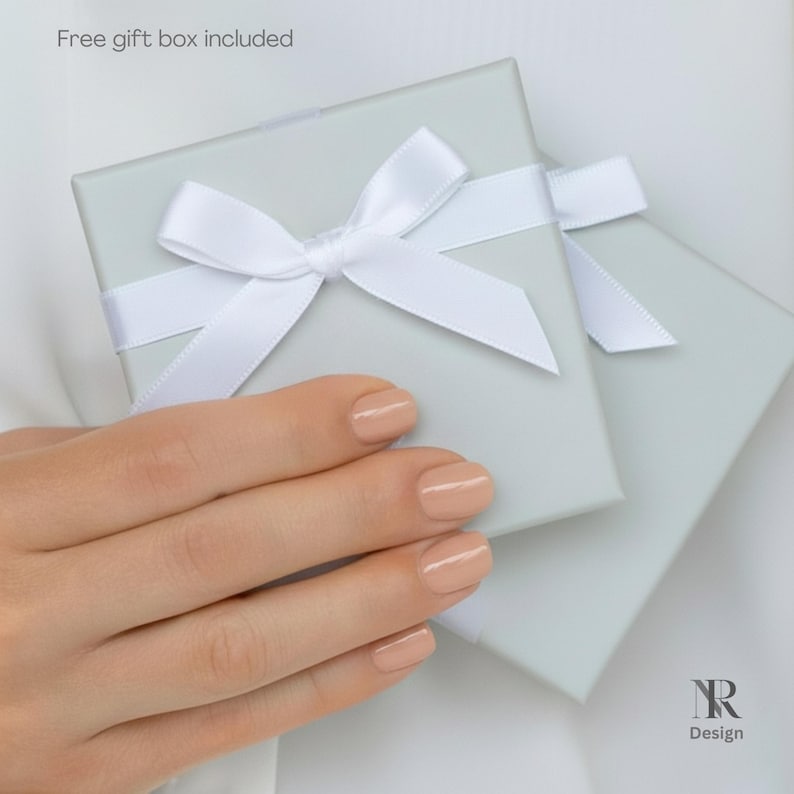 White minimalist gift box with satin ribbon for the tiny block initial necklace. Premium packaging for 14K gold plated OVER solid 925 sterling silver jewelry. Ready for gifting.