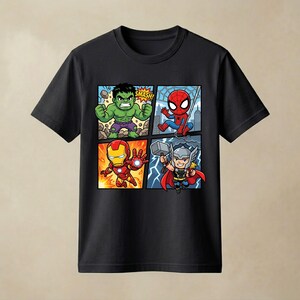 May include: A black short-sleeved t-shirt featuring a four-panel graphic print of cartoon superheroes. The panels display the Hulk with the text SMASH, Spider-Man on a web, Iron Man in flight, and Thor holding a hammer amidst lightning bolts.