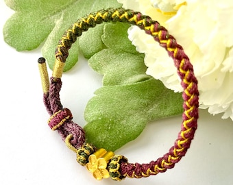 Handwoven Buddhist Bracelet: Gold Flower Charm, Adjustable Elegant Jewelry