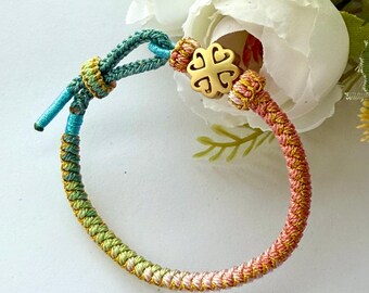 Handmade Woven Bracelet: Gold Clover Charm, Adjustable Buddhist Bangle