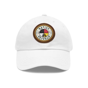 May include: White baseball cap with a brown leather patch featuring a Native American design and the text "NATIVE VETERAN".