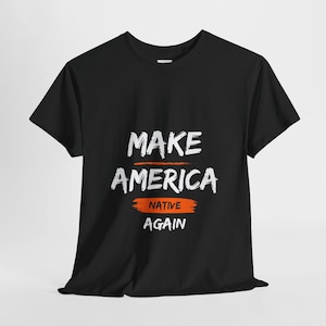May include: Black t-shirt with white text that reads "Make America Native Again".