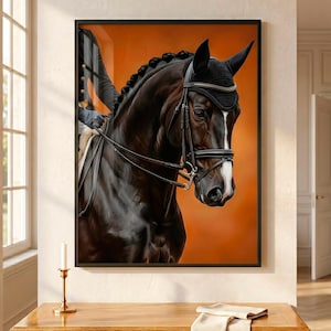 May include: A framed wall art print depicting a dark brown horse with a white blaze on its face, wearing a black bridle and a black ear bonnet. The horse has a braided mane and is shown from the chest up against a solid orange background.