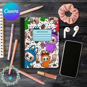 May include: A composition notebook featuring a monster and coffee design, surrounded by stationery items like pens, a scrunchie, and a phone. The notebook has the words "Composition Book" on it. The word "Canva" is visible in a blue circle.