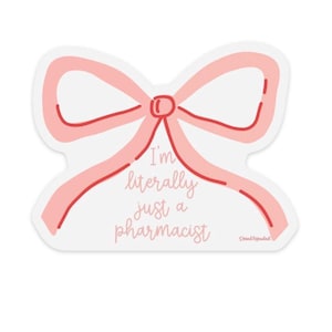 May include: A die-cut sticker shaped like a light pink bow with a dark pink outline. The center of the bow features the text "I'm literally just a pharmacist" in a cursive pink font, with a small signature in the bottom right corner.