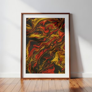 May include: Abstract art print in a wooden frame. The artwork features a swirling pattern of red, gold, and black colors. The framed art is displayed on a wooden floor against a white wall.
