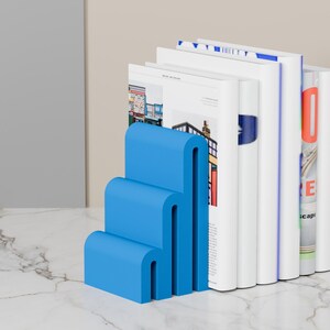 blue bookends with books