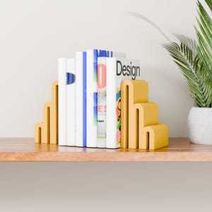 yellow bookends with books