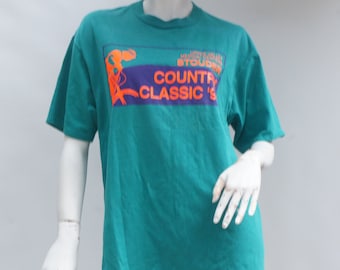 Camiseta vintage de los 90 con estampado neón de bicicleta Stouder Country Classics 95