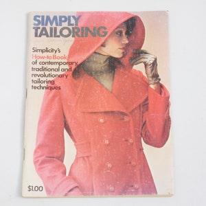 May include: A vintage book titled "Simply Tailoring" with a red coat and a woman wearing it on the cover. The book is a how-to guide for contemporary, traditional, and revolutionary tailoring techniques.
