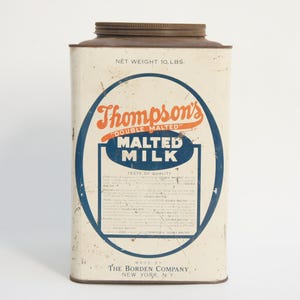May include: Vintage Thompson's Double Malted Milk tin. The rectangular tin has a cream-colored background with a blue oval design. The text "Thompson's Double Malted Milk" is in orange and blue. The tin is marked "Net Weight 10 lbs."