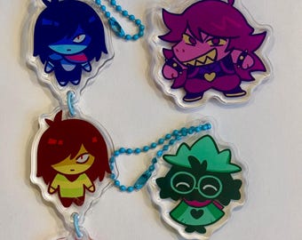 Fun gang acrylic charms, Kris, susie, ralsei. Kris linked charm