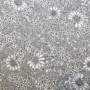 May include: A black and white floral pattern with a variety of flower shapes and sizes. The pattern is on a white background.