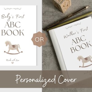 Printable baby shower ABC book featuring animals A–Z, ready-to-color pages, and a section for guests to write loving prayers or notes.