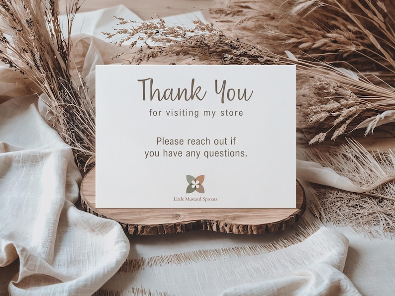 A white card with the words "Thank You" in a handwritten style font. The text "for visiting my store" and "Please contact me if you have any questions" are also present. The card includes a floral logo and the words "Little Mustard Sprouts".