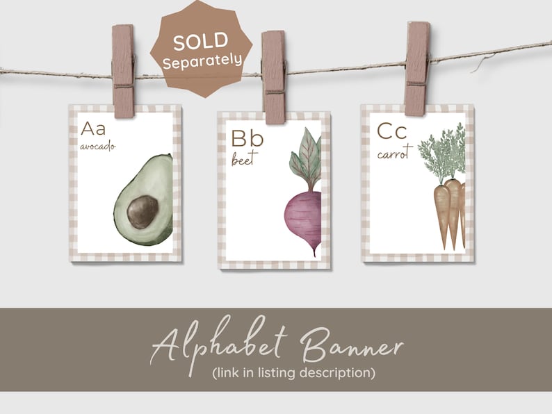 A white ABC book titled 'Logan's First ABC BOOK' with illustrations of a carrot, basket, and baby clothes. The book is displayed with other pages that say 'C is for carrot' and 'E is for eggs'. The image has a light brown background with five white heart outlines.