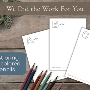 A children's ABC book with a watercolor illustration of a goose, accompanied by letter outlines and the text "Just bring the crayons." The book is part of a set, with the text "We Did the Work For You."