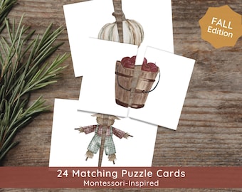 May include: A set of 24 matching puzzle cards with watercolor illustrations of fall themes, including a pumpkin, apples in a bucket, and a scarecrow. The cards are labeled "Fall Edition" and "24 Matching Puzzle Cards Montessori-Inspired."