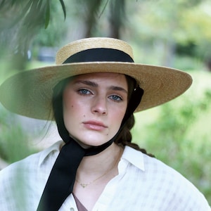 Wide Brimmed Natural Straw Boater Hat with a long chin strap ribbon Amal