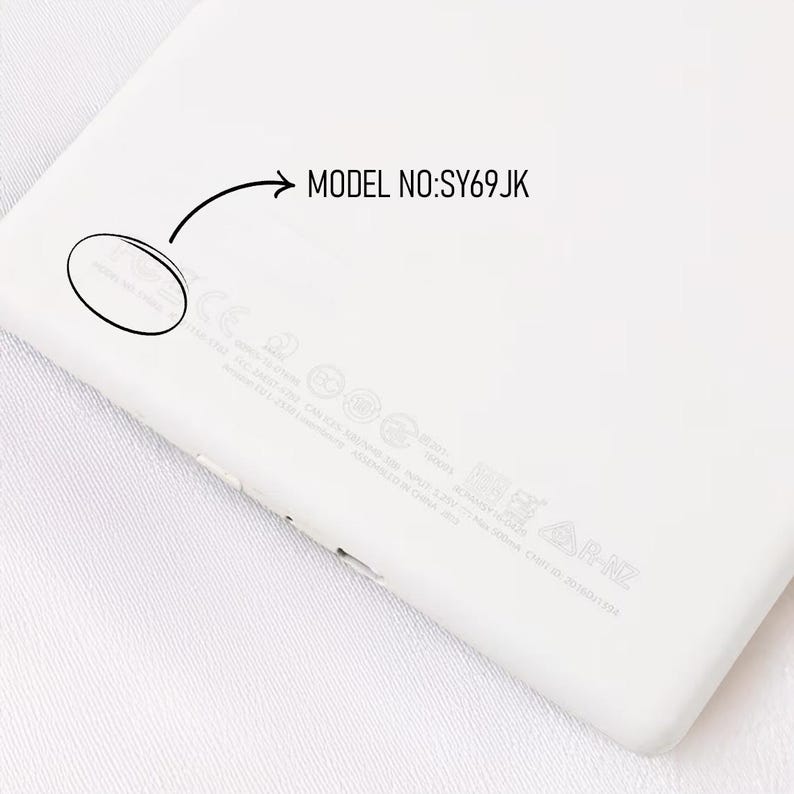 May include: A close-up of a white electronic device with rounded corners. The text "MODEL NO: SY69JK" is printed on the device. Additional text and symbols are also visible.