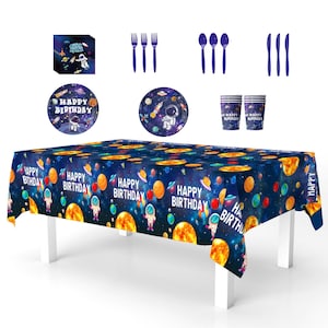 May include: A space-themed birthday party set featuring a dark blue tablecloth with planets and astronauts, plates, cups, and cutlery. The tablecloth has "Happy Birthday" text. Includes forks, spoons, and knives in a matching blue color.