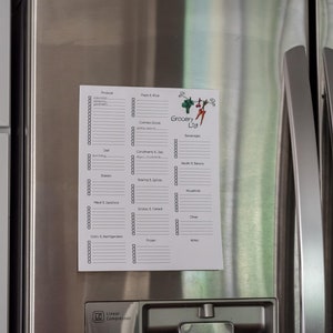 May include: A white grocery list with a colourful logo is attached to a stainless steel refrigerator. The list is divided into sections for various grocery items, such as produce, dairy, and frozen foods. The words "Grocery List" are at the top.