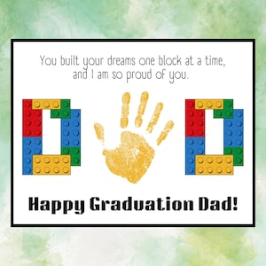May include: A white card with the text You built your dreams one block at a time, and I am so proud of you. The word DAD is spelled with colorful plastic building blocks, with a yellow handprint replacing the letter A. Happy Graduation Dad!