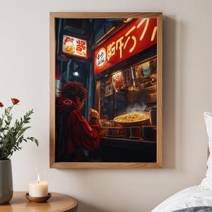May include: A person in a red hoodie stands in front of a brightly lit food stall in a Japanese street. The stall has a red sign with Japanese characters that read "ramen". The person is looking at the food in the window, which includes a bowl of steaming ramen noodles.