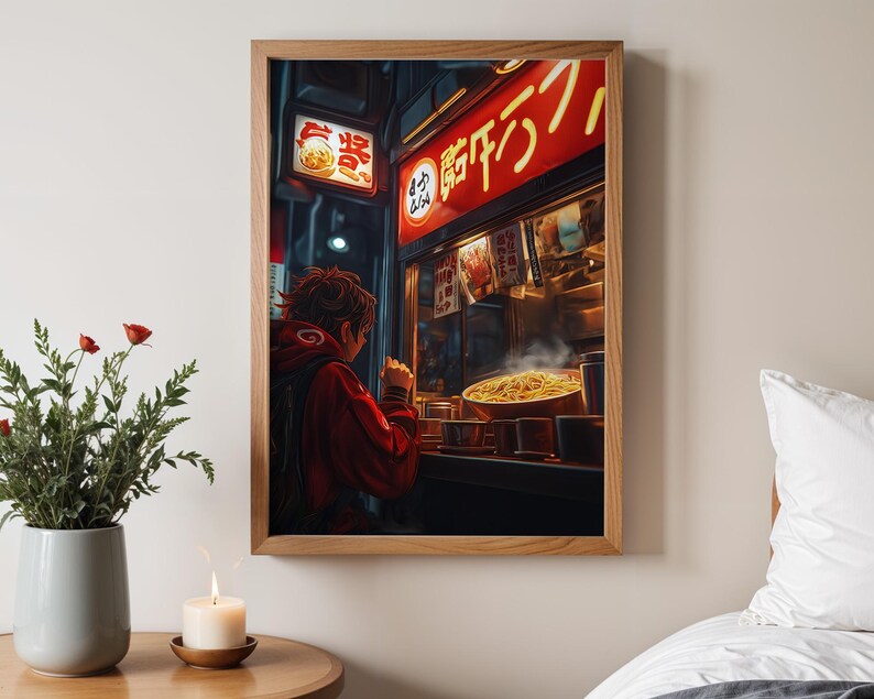 May include: A person in a red hoodie stands in front of a brightly lit food stall in a Japanese street. The stall has a red sign with Japanese characters that read "ramen". The person is looking at the food in the window, which includes a bowl of steaming ramen noodles.