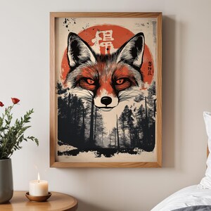 May include: A digital illustration of a red fox with a red sun behind it. The fox is looking directly at the viewer. The background is a dark forest with trees. The Japanese characters "Kitsune" and "狐" are written in white on the sun.