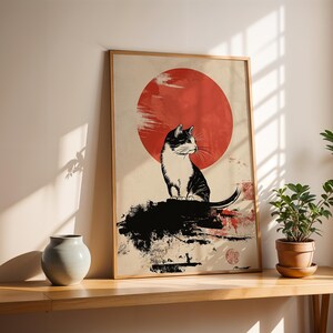 May include: A black and white cat sits on a rock in front of a large red sun. The image is in a minimalist style with black ink lines and a white background.