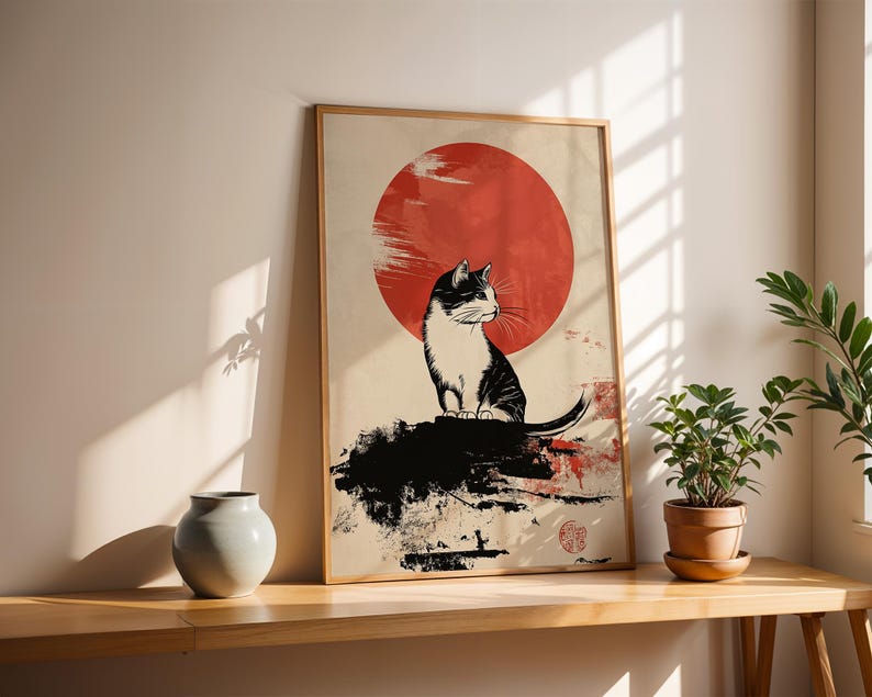 May include: A black and white cat sits on a rock in front of a large red sun. The image is in a minimalist style with black ink lines and a white background.