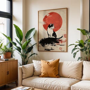 May include: A black and white cat sits on a rock with a red sun behind it. The image is in a minimalist style with black ink lines and a red sun.