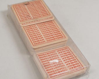 May include: A stack of square cardboard coasters with the words "Cheap Coasters" printed in red on each coaster.