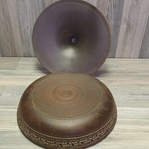 Handmade red clay tagine dish with lid for oven cooking