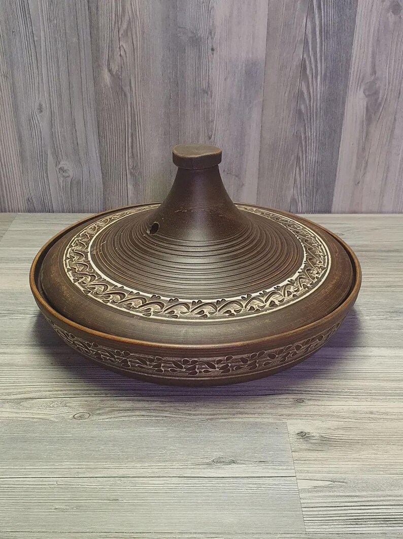 Moroccan-style clay pot with conical lid for roasting