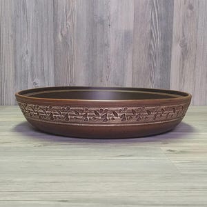 Traditional Moroccan clay tagine with lid for baking