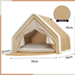May include: A beige cat house with a triangular roof, measuring 50cm long, 40cm high, and 35.5cm wide. It features a hemp mat scratching post and a soft interior bed. The frame is light-colored wood with a white trim.