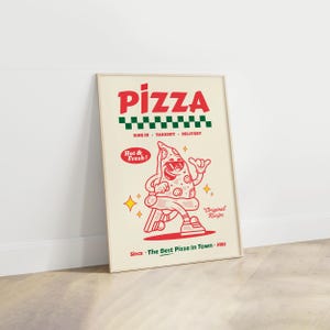 May include: A framed poster with a retro pizza theme. The word "PIZZA" is in red, above a green and black checkered pattern. A cartoon pizza slice with sunglasses is featured. Text includes "DINE IN TAKEOUT DELIVERY", "Hot & Fresh!", and "Since The Best Pizza In Town - 1981".