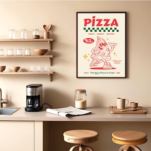 May include: A framed pizza-themed poster with a cartoon slice of pizza wearing sunglasses and a red and white color scheme. The poster includes the text "PIZZA", "Dine In, Takeout, Delivery", and "Since The Best Pizza In Town - 1981". The poster is hanging in a kitchen.