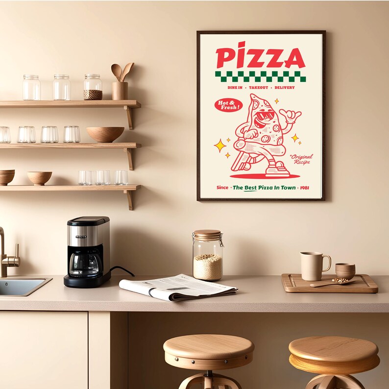 May include: A framed pizza-themed poster with a cartoon slice of pizza wearing sunglasses and a red and white color scheme. The poster includes the text "PIZZA", "Dine In, Takeout, Delivery", and "Since The Best Pizza In Town - 1981". The poster is hanging in a kitchen.