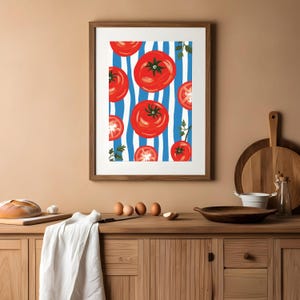 May include: A framed print of red tomatoes on a blue and white striped background. The tomatoes are arranged in a repeating pattern and are surrounded by green parsley.