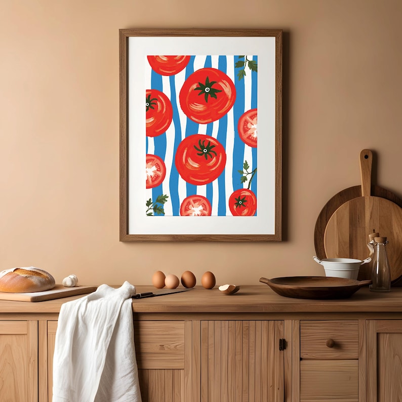 May include: A framed print of red tomatoes on a blue and white striped background. The tomatoes are arranged in a repeating pattern and are surrounded by green parsley.