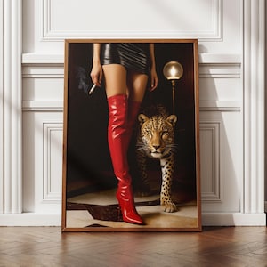 May include: A framed art print depicting a woman in a black mini skirt and red thigh-high boots, holding a cigarette, alongside a leopard. The artwork has a dark, dramatic aesthetic, with a vintage lamp in the background.